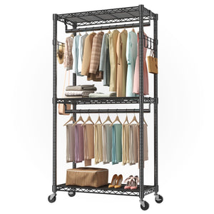 Black metal clothing rack with clothes and shoes on a white background