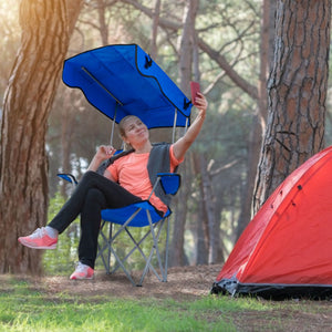 Beach camping chair with protective canopy providing shade from direct sunlight