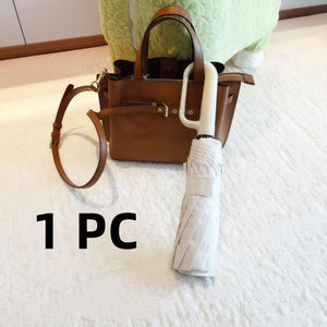 Portable black umbrella with durable waterproof canopy for everyday weather protection