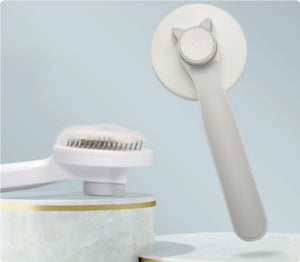 Lightweight cat grooming brush with ergonomic design
