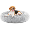 Grey plush donut dog bed for calming anxiety in small dogs